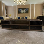 Modern Luxury TV Stand with Rounded Corner Design, High-Gloss Wood Finish and Gold-Framed Storage Compartments